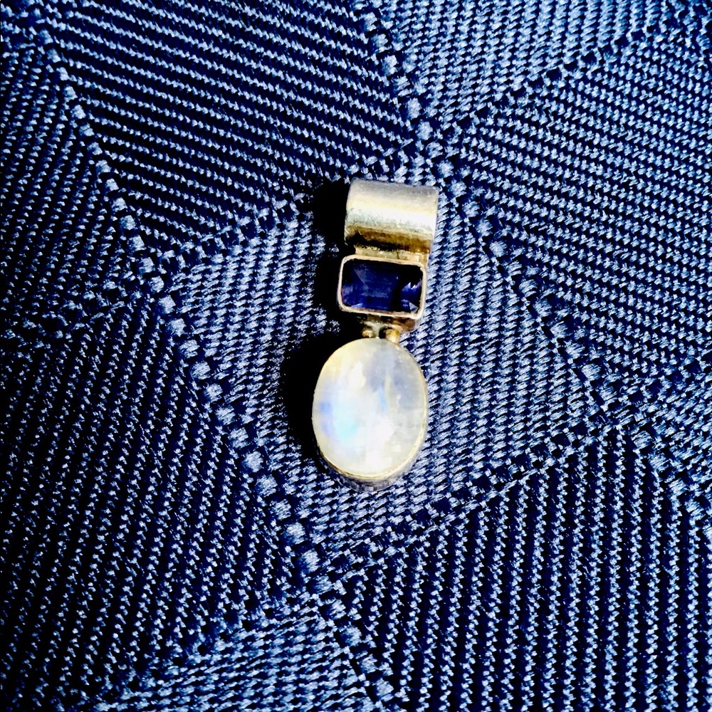 Silver pendant with stones